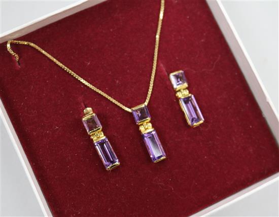 An amethyst and 9ct gold pendant and a pair of earrings en suite, the pendant on 18ct gold chain,